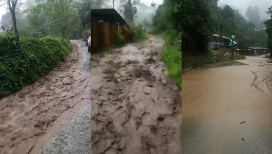 Salida del colegio por la vía convertida en un río, en zona rural de Caldas